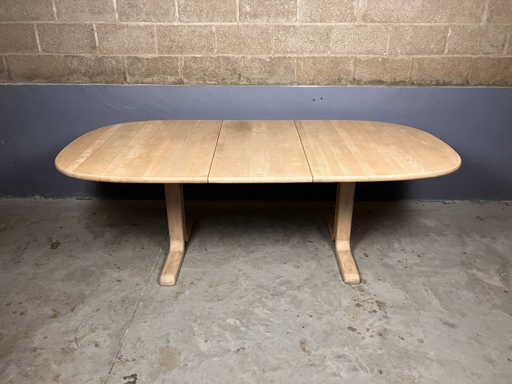 Oval extendable dining table in beech with Danish design.