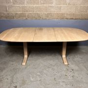 Oval extendable dining table in beech with Danish design.