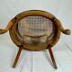 Fauteuil bas anglais en bois ajouré à assise cannée, 19e siècle