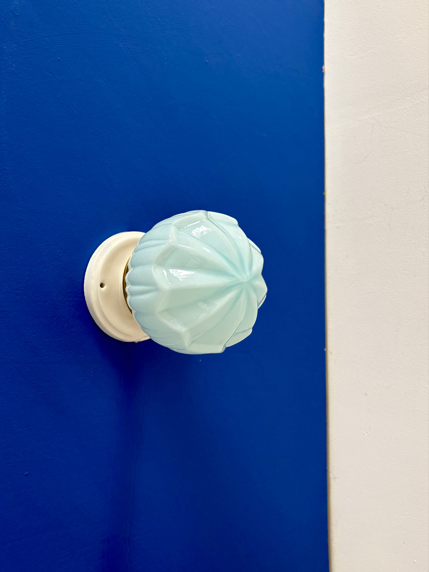 Vintage Art Deco globe wall light in blue opaline.
