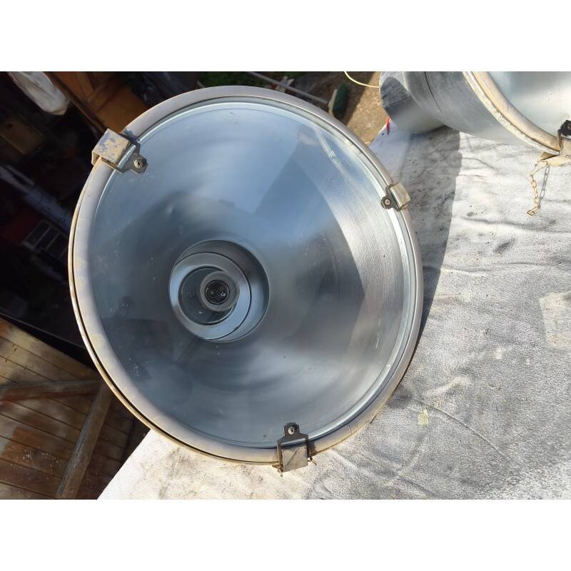 Pair of industrial pendant lights in aluminium and glass.