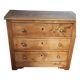 Rustic English pine chest of drawers with porcelain knobs.