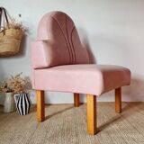 Single bar stool in pink stitched faux leather.
