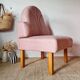 Single bar stool in pink stitched faux leather.