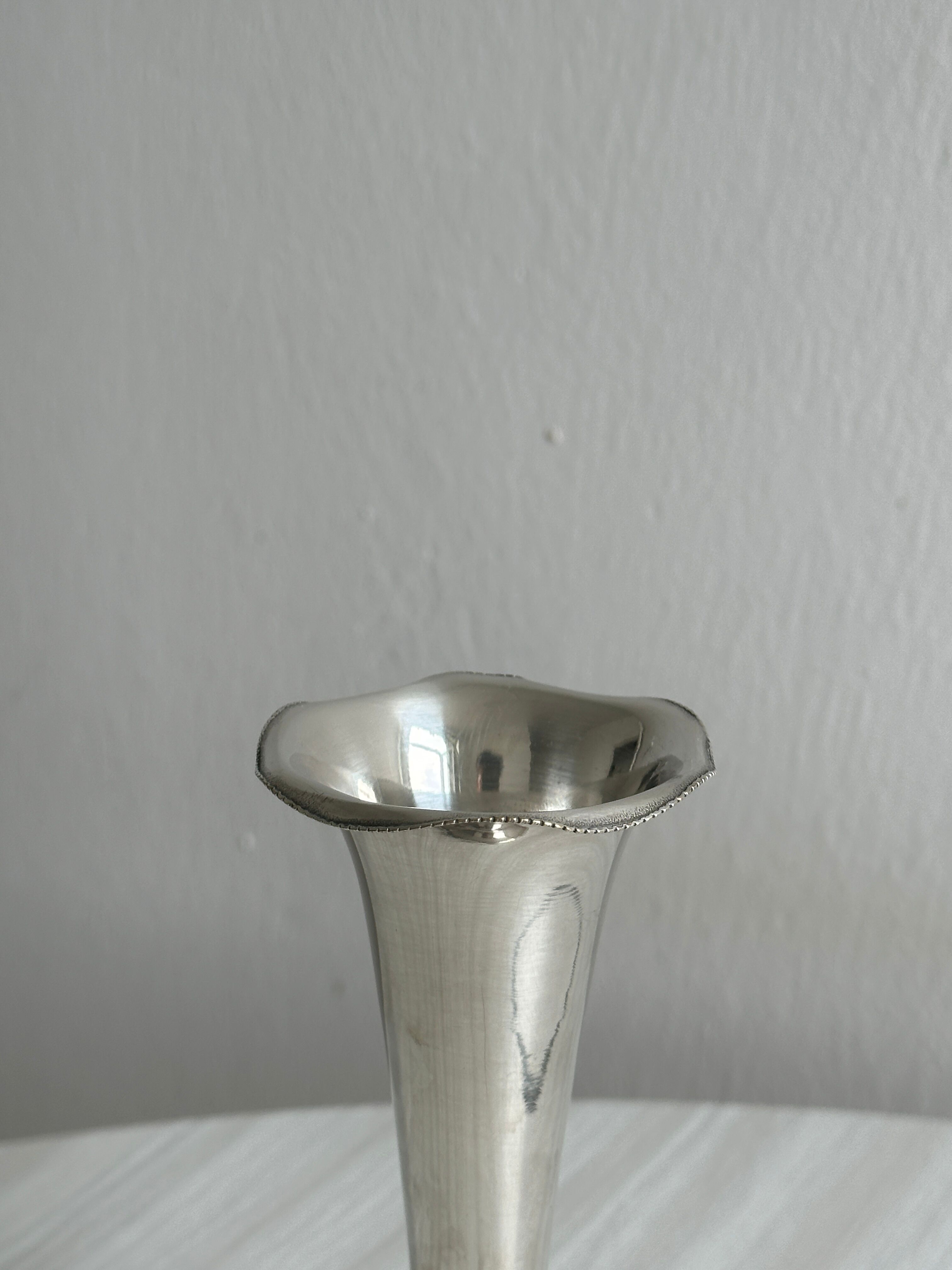small antique silver-plated metal vase