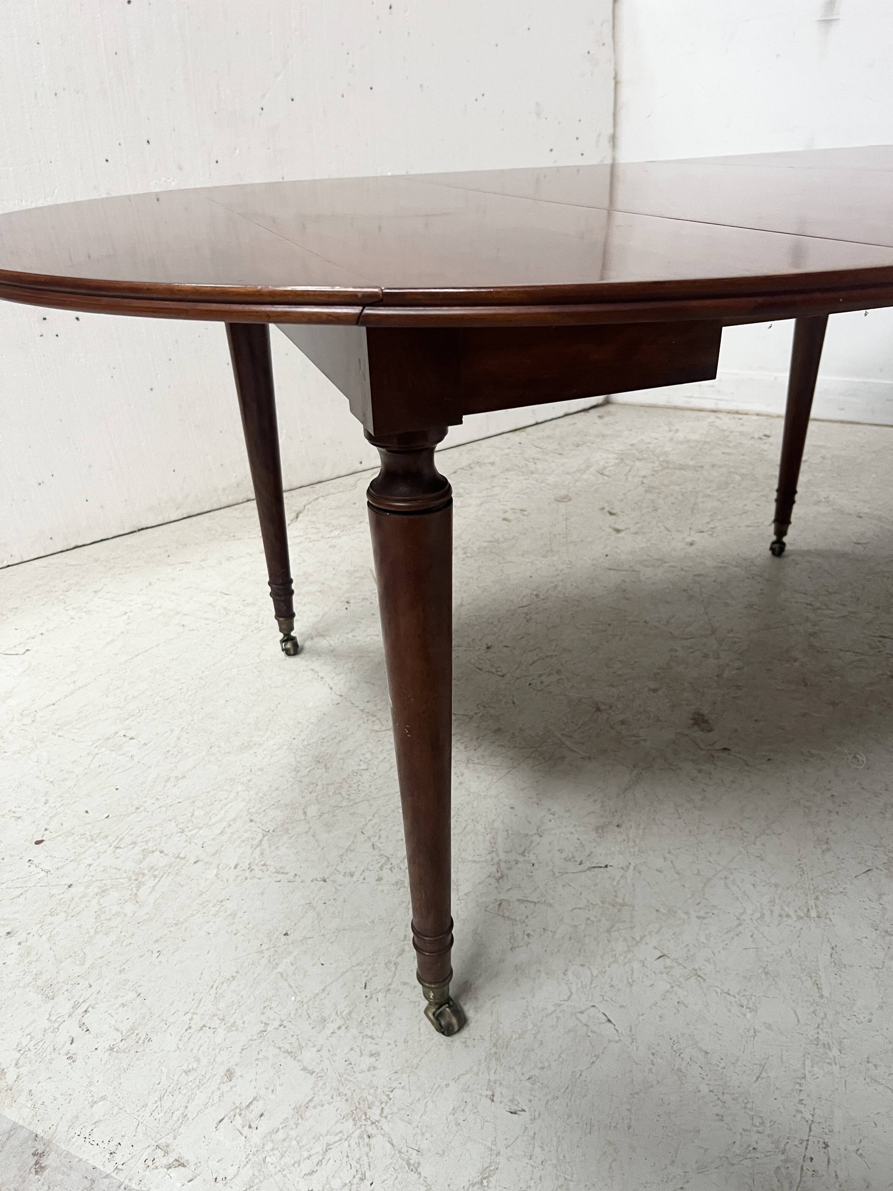 A six-foot Louis XVI style mahogany table from the 19th century.