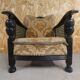 Old armchair upholstered in velvet, carved and caned wood