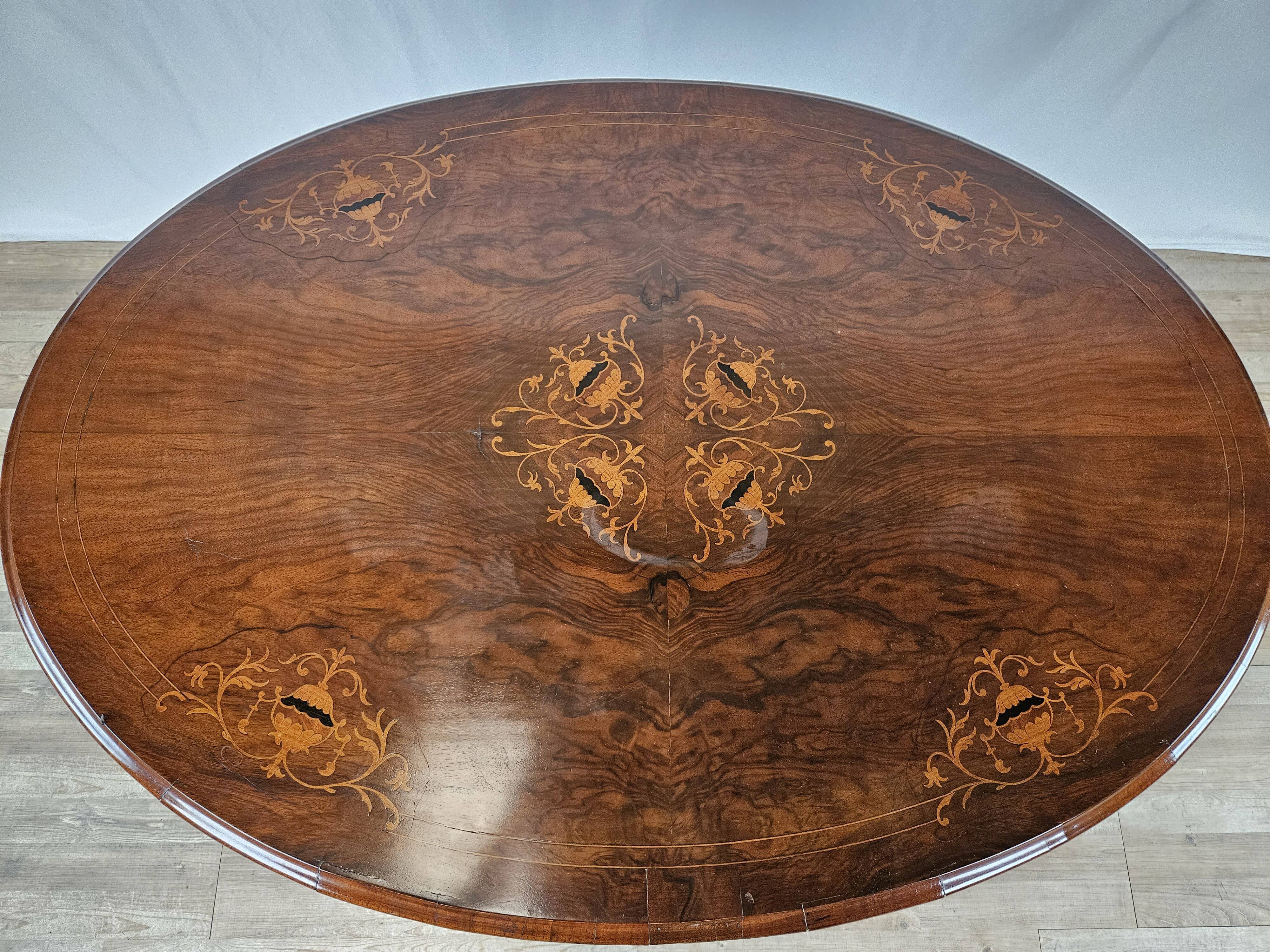 Coffee table in walnut with maple inlays and wheels