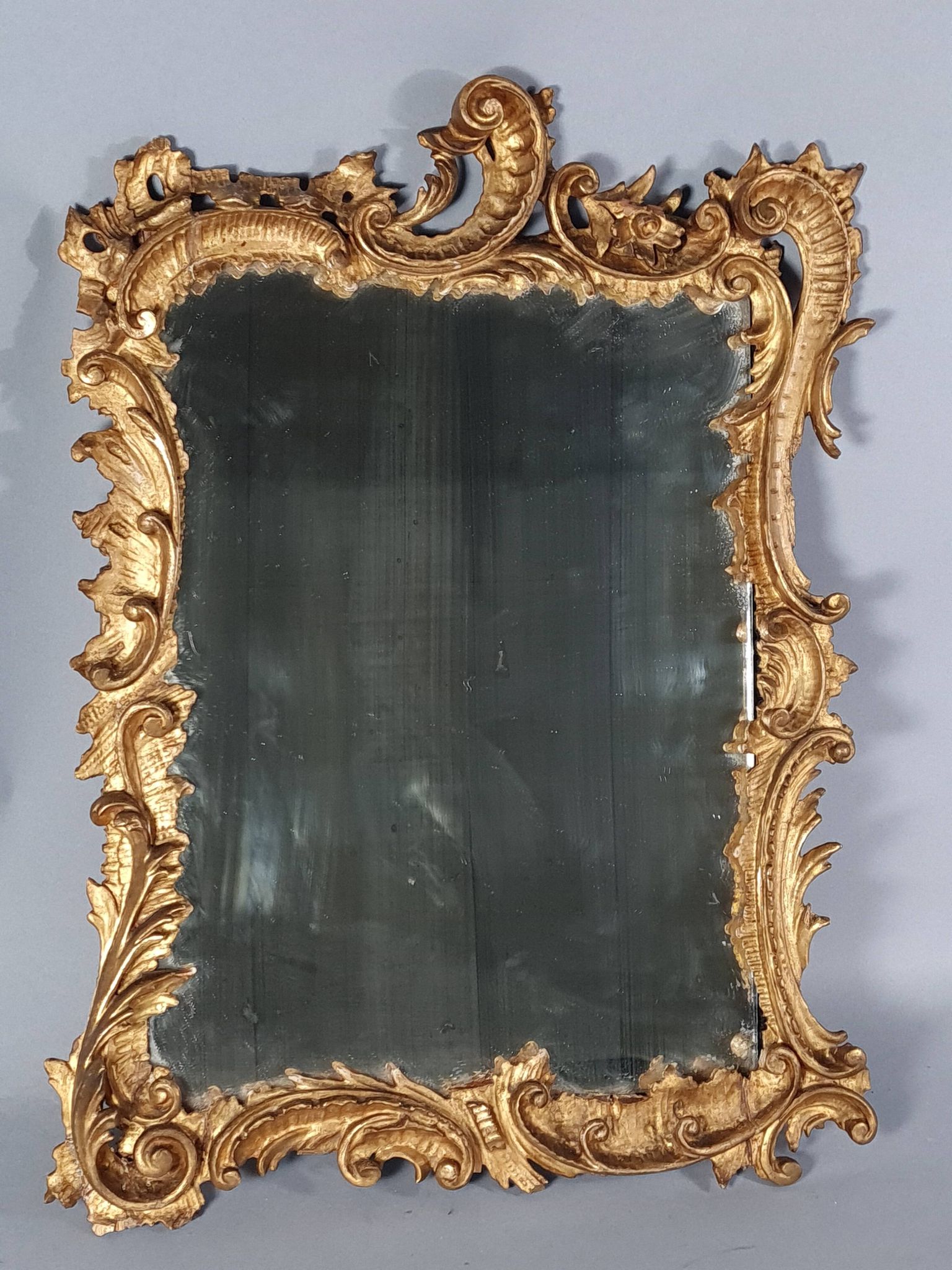 Mirror circa 1800, carved and gilded wooden frame, rocaille decoration, 54x39 cm, C227