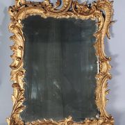 Mirror circa 1800, carved and gilded wooden frame, rocaille decoration, 54x39 cm, C227
