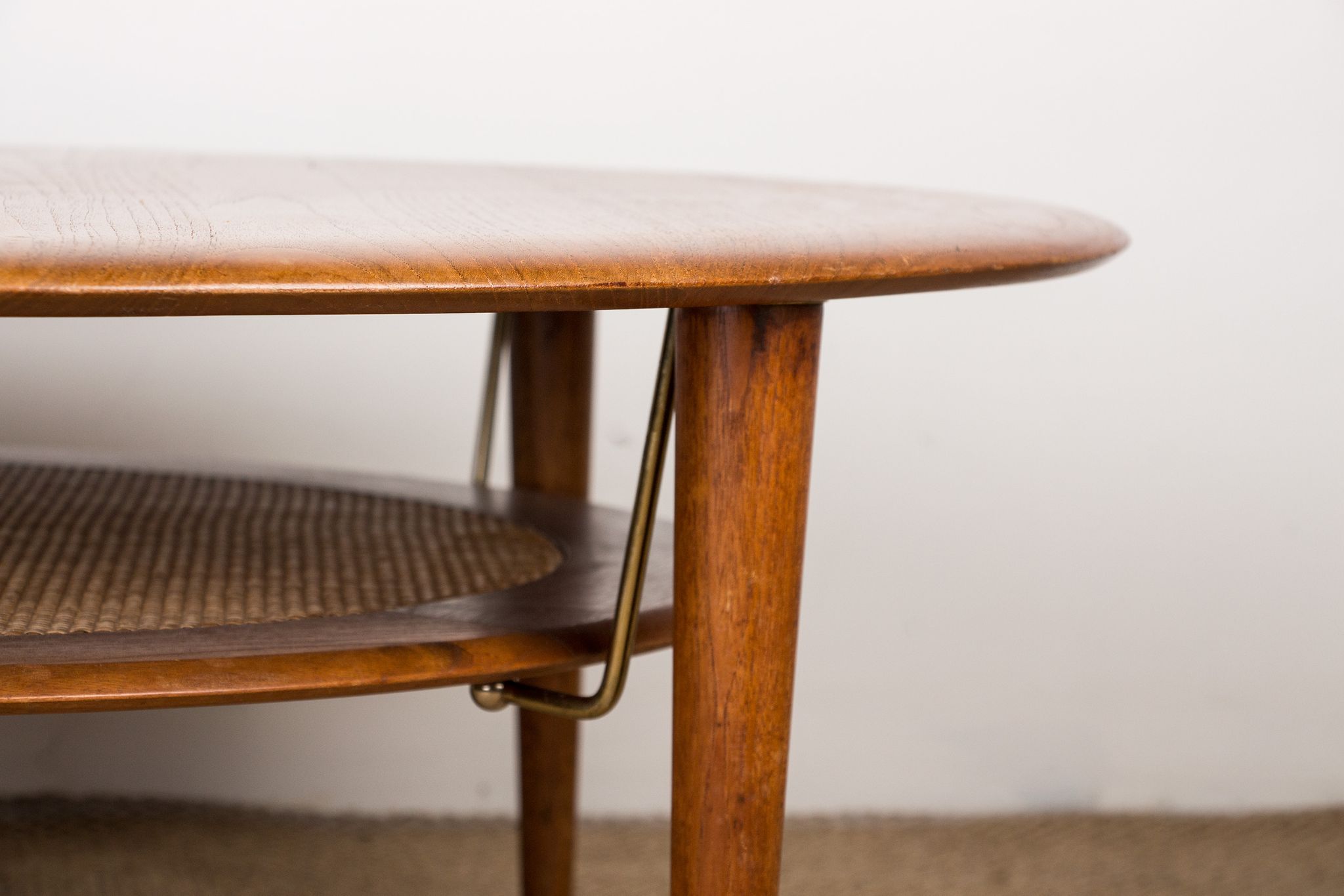 Round coffee table, two levels, danish in teak, brass and cannage