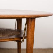 Round coffee table, two levels, danish in teak, brass and cannage