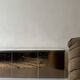 Low ivory lacquered enfilade, smoked mirror & brass JC Mahey, design 1970.