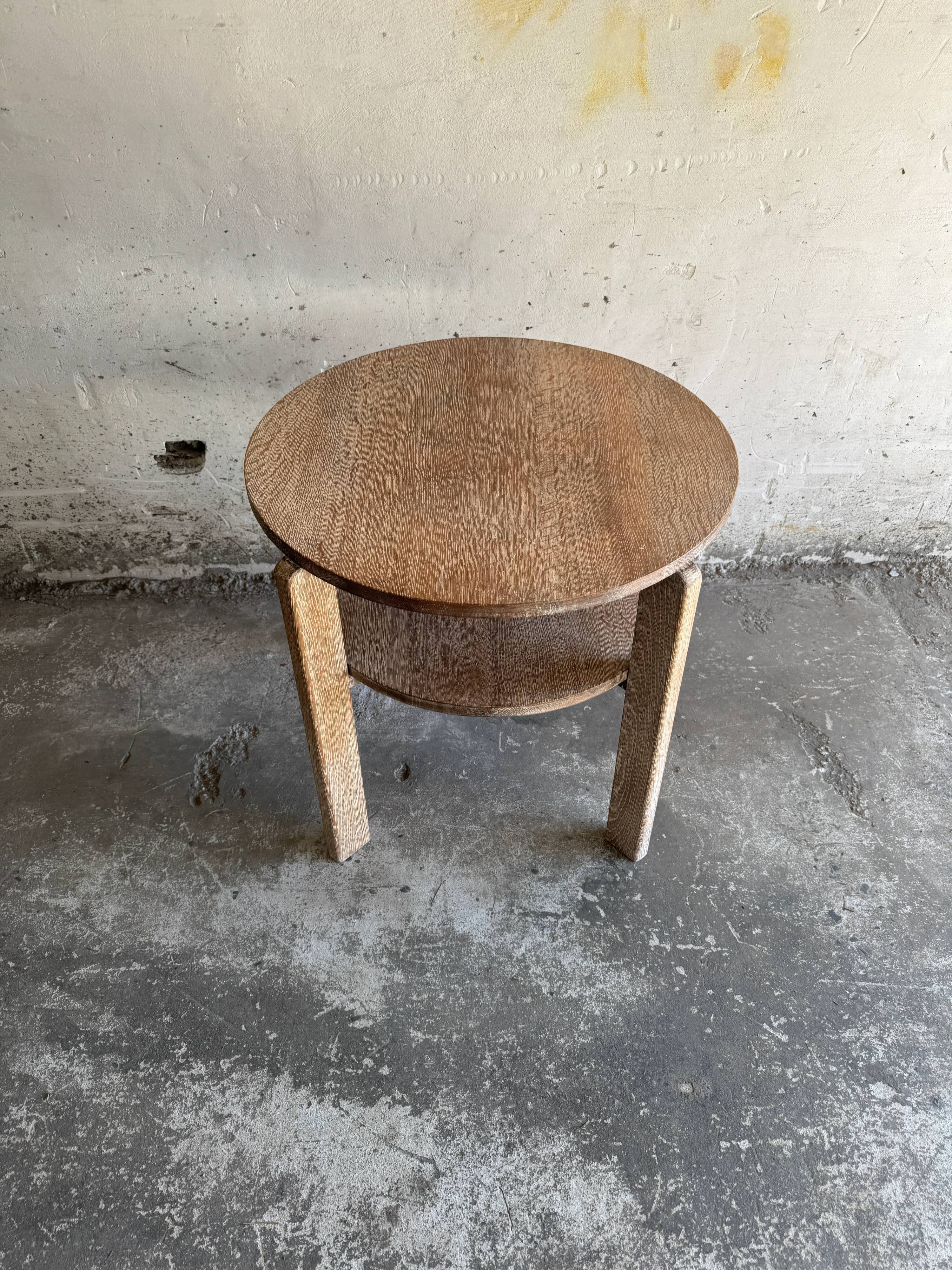 Art Deco round oak side table in light weathered oak with lower shelf, geometric three-leg design
