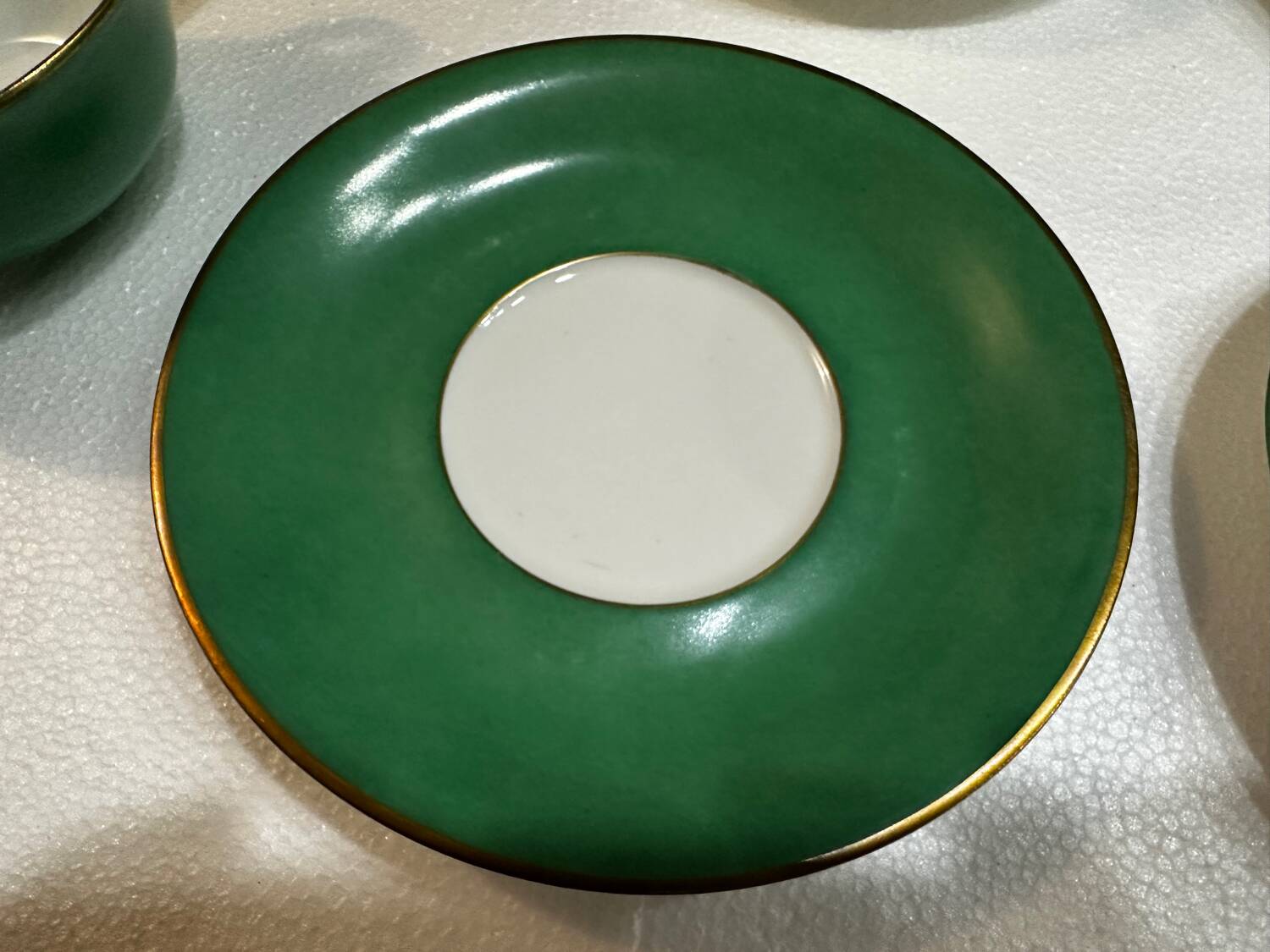 Service 14 cup and saucer in Art Deco Emerald Green and Gold.