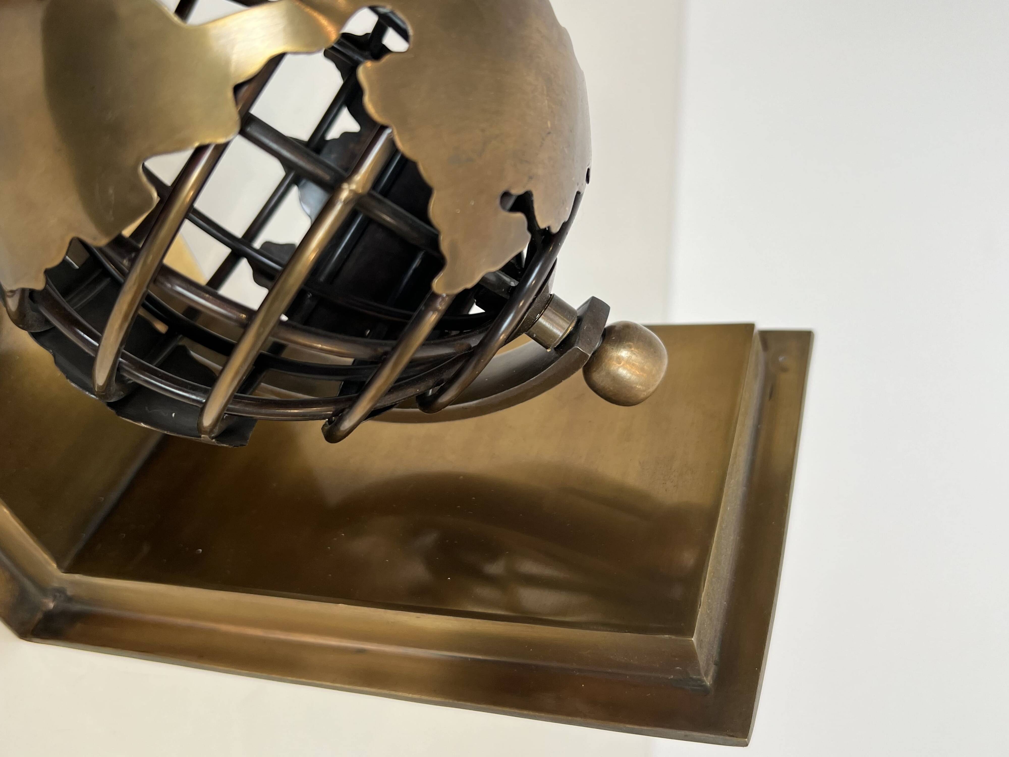 Pair of Brass Bookends with Openwork Globe Decorations. Work