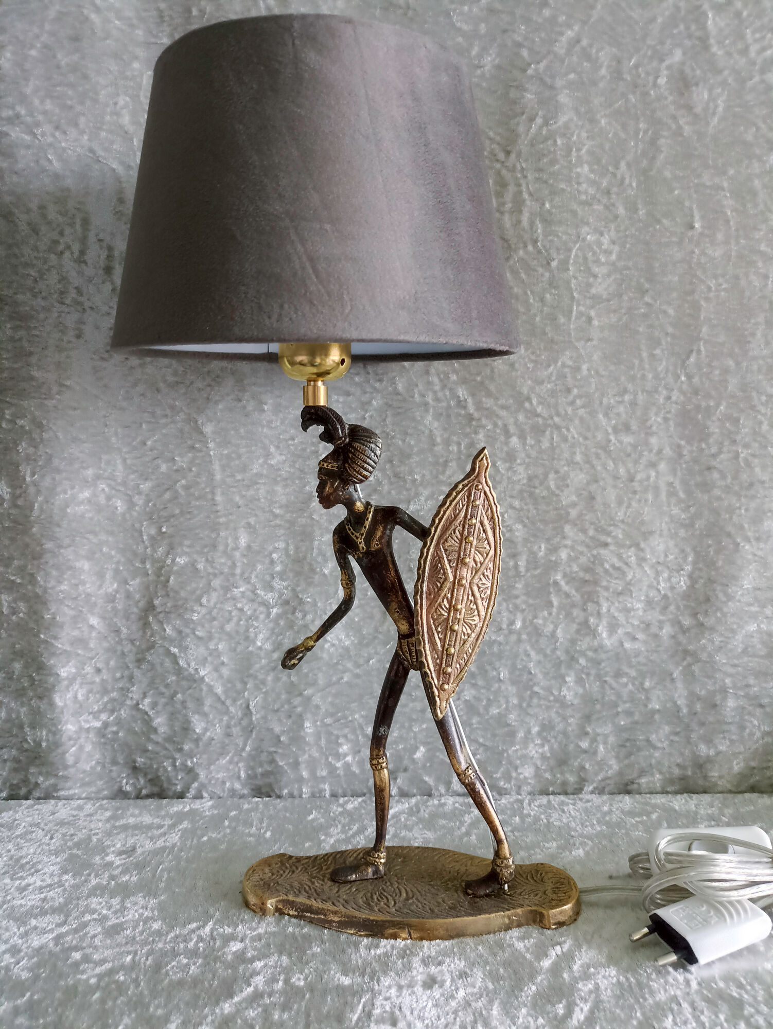 African warrior lamp in bronze.