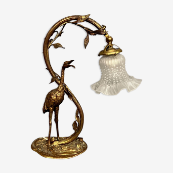 Gilded bronze lamp with the figure of a heron in Art Nouveau style.