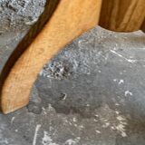 Vintage natural wood stool with light yellow faux leather seat and crossed splayed base