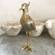 Crested bird in golden brass