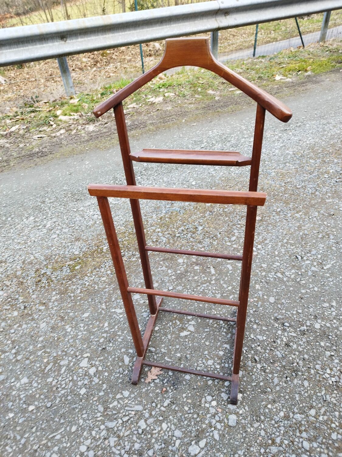 Valet wearing double wood coat rack