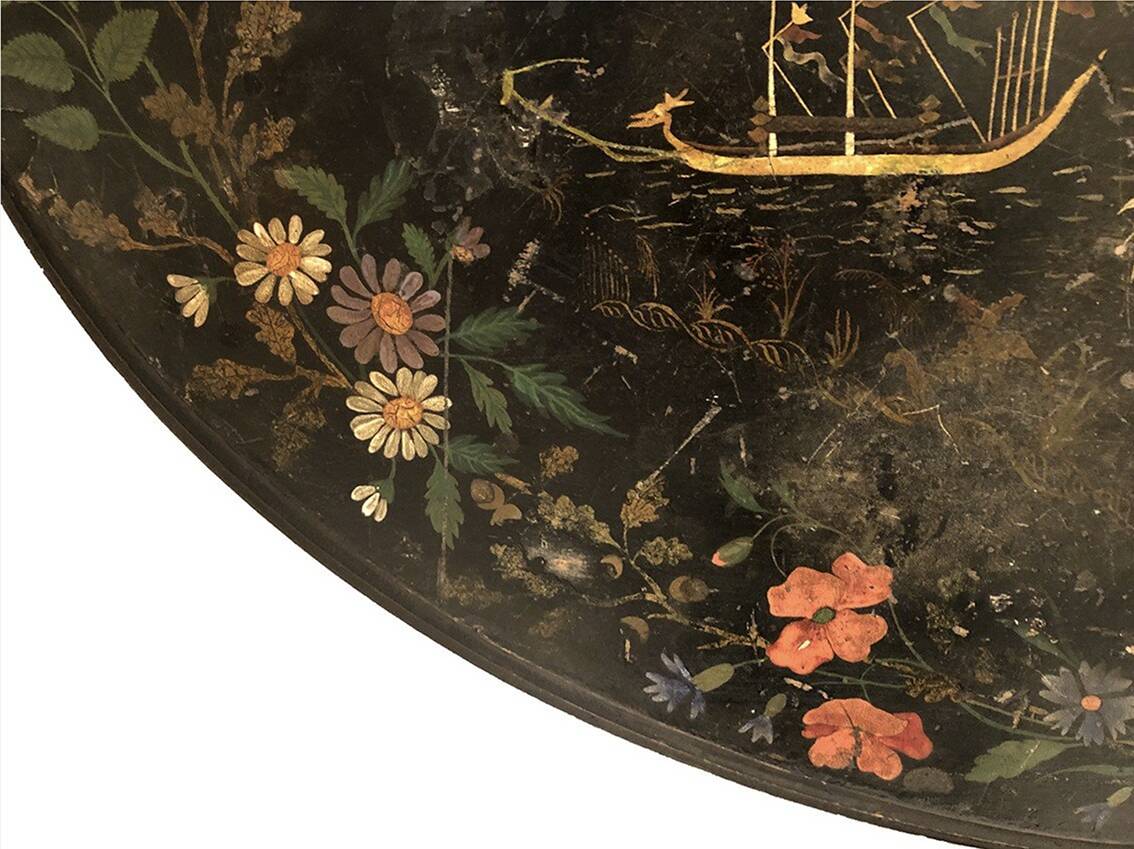 Large tilting pedestal table, black lacquered wood with a lively oriental landscape decoration.