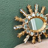 Sun mirror with parecloses, carved wood