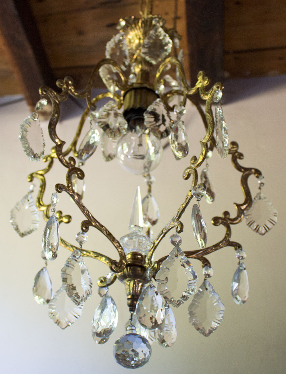 Old brass chandelier with glass stamps