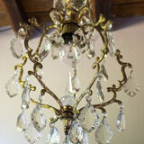 Old brass chandelier with glass stamps