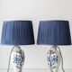 Pair of Royal Delft blue and white ceramic table lamps, 1905, with new pleated silk shades.