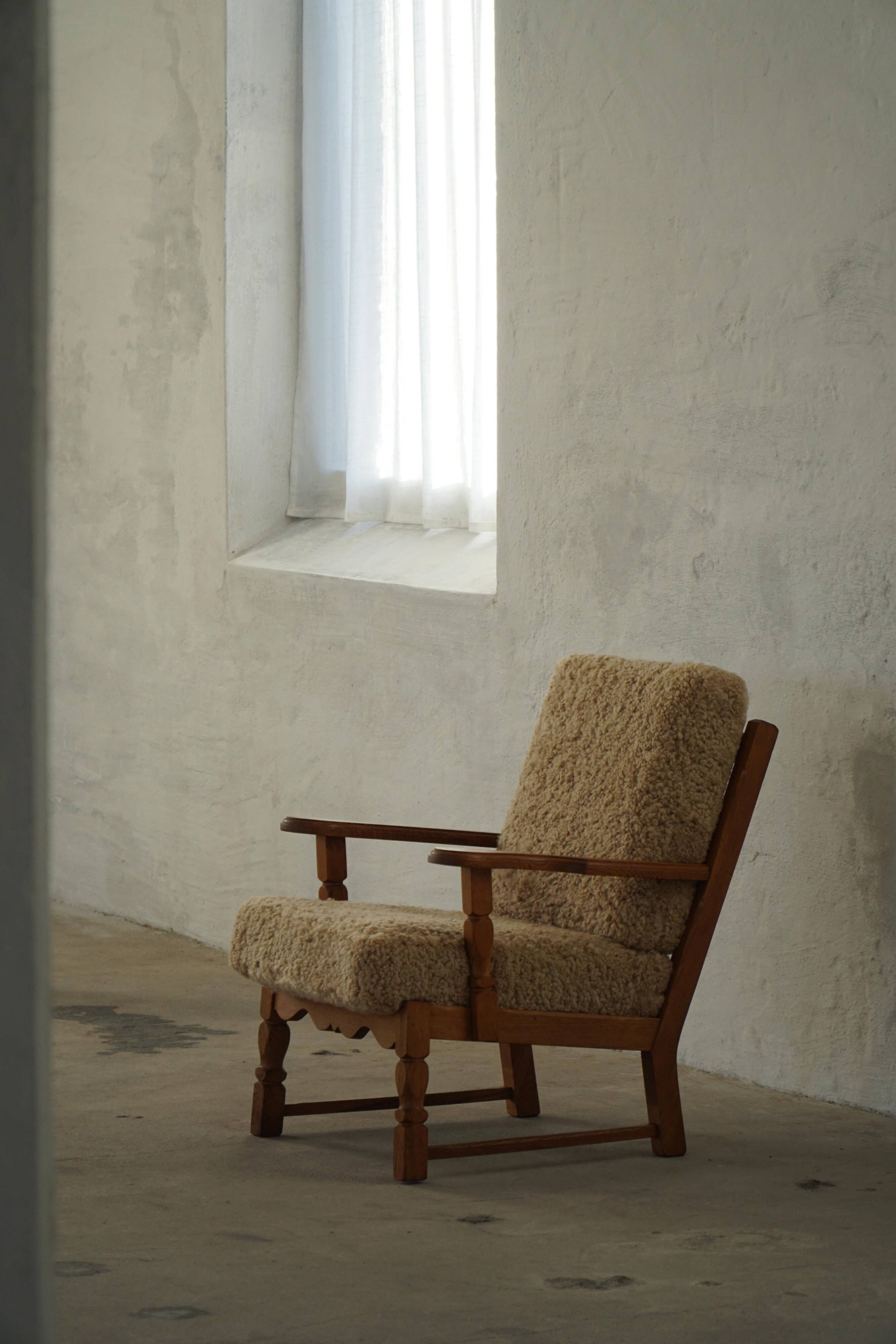 Danish modernist lounge chair in oak and lambswool, Henning Kjærnulf, 1960s