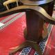 Nightstand in the shape of a lyre.