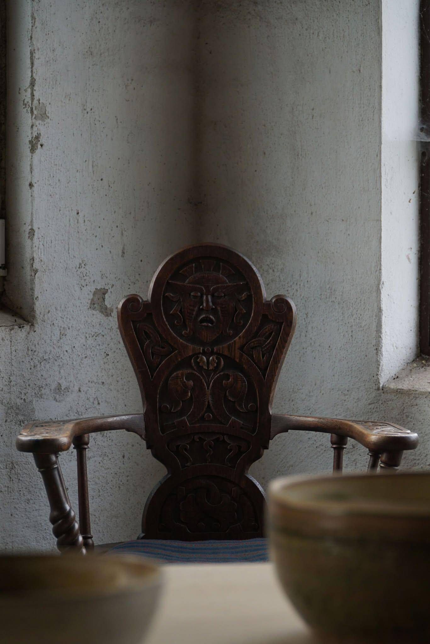 Scandinavian armchair in solid oak with cushion, folk art, early 19th century.