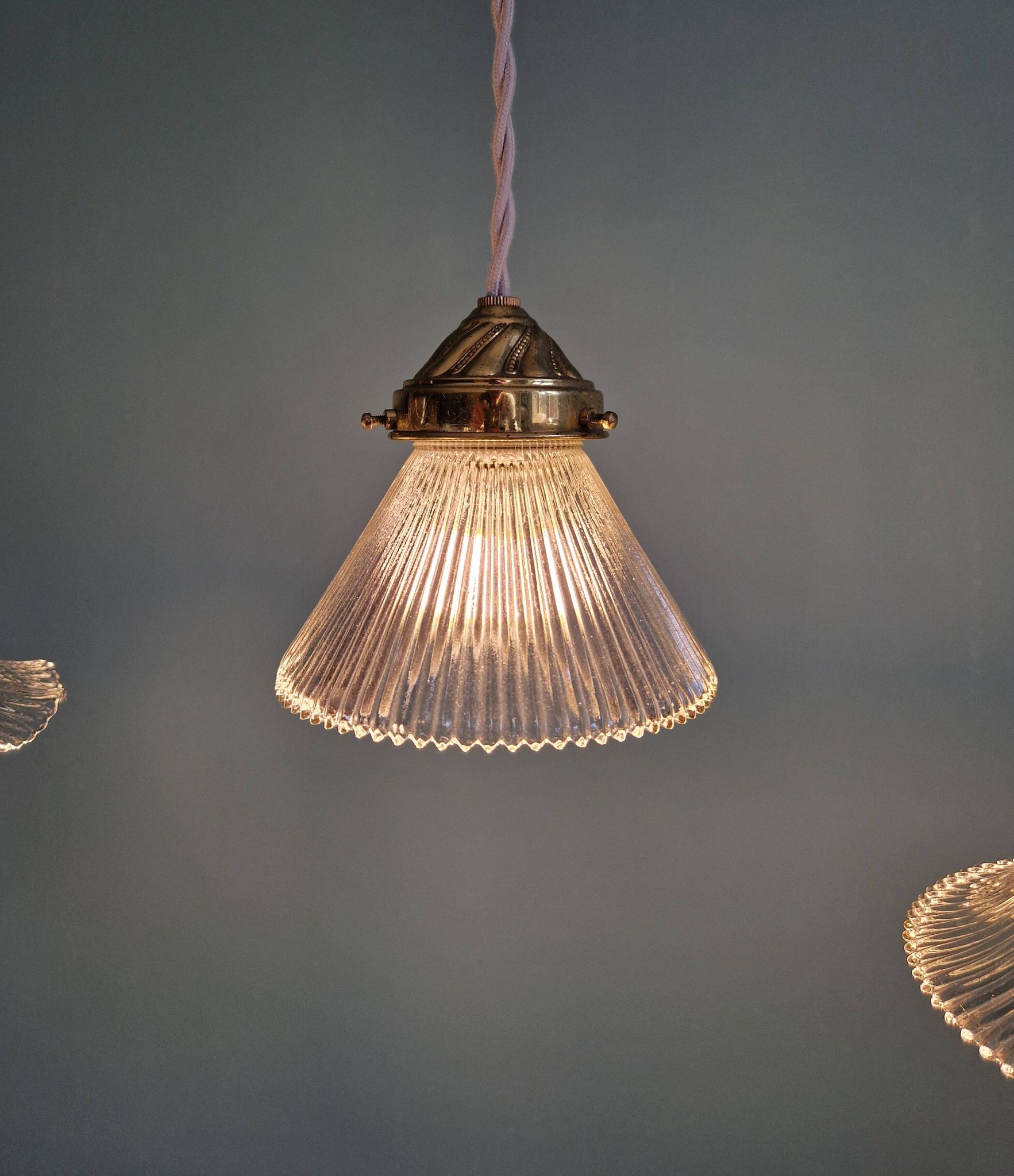 Trio of Art Deco grooved glass pendant lights, 1920s-30s