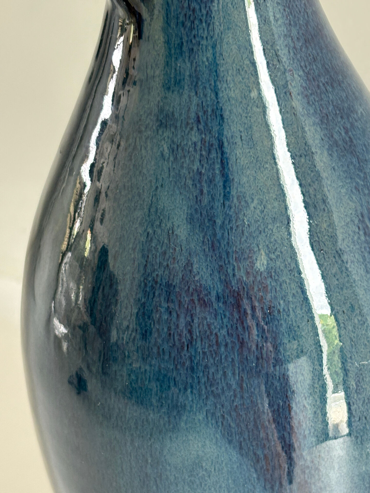 Decorative deep blue glazed ceramic vase with twin handles.
