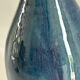 Decorative deep blue glazed ceramic vase with twin handles.