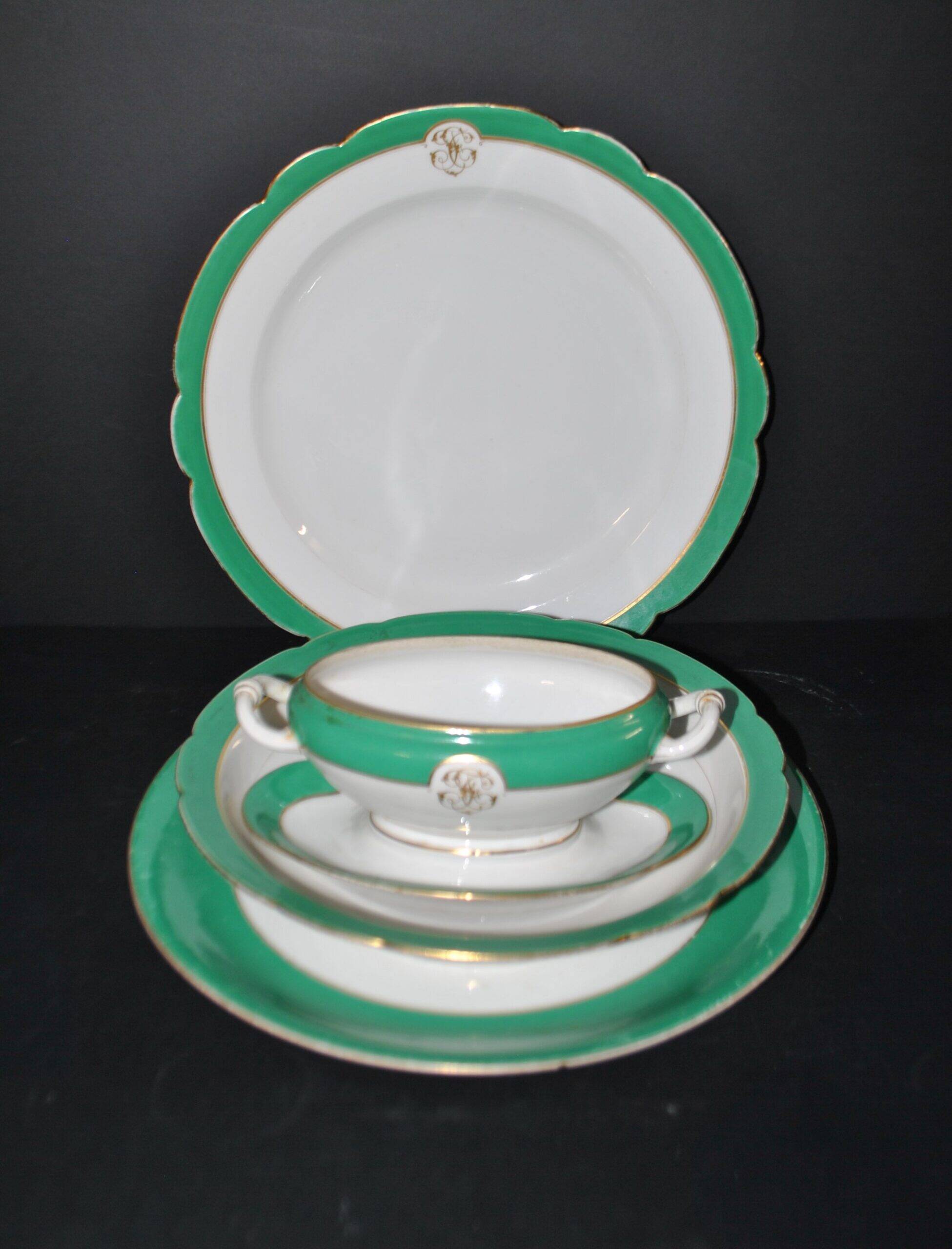 Paris porcelain set of 3 plates and a sauce boat with green border and gold monogram JC.