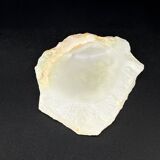 Empty pocket bowl made of translucent natural stone.
