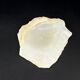 Empty pocket bowl made of translucent natural stone.