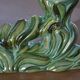 Pair of iridescent green ceramic Art Deco candlesticks