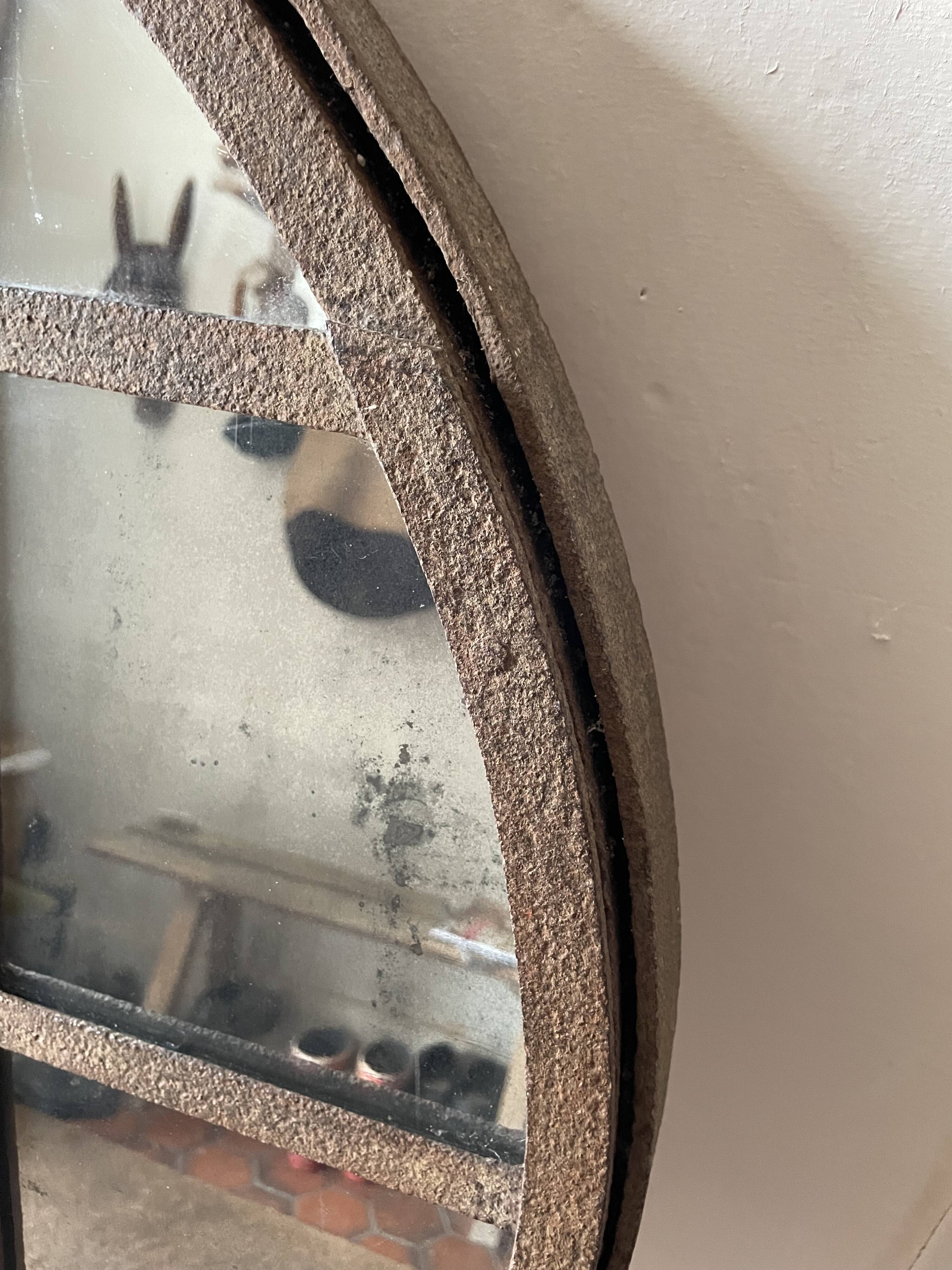 Round mirror mounted in mild steel