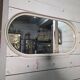 Oval mirror in white lacquer from the 1970s.