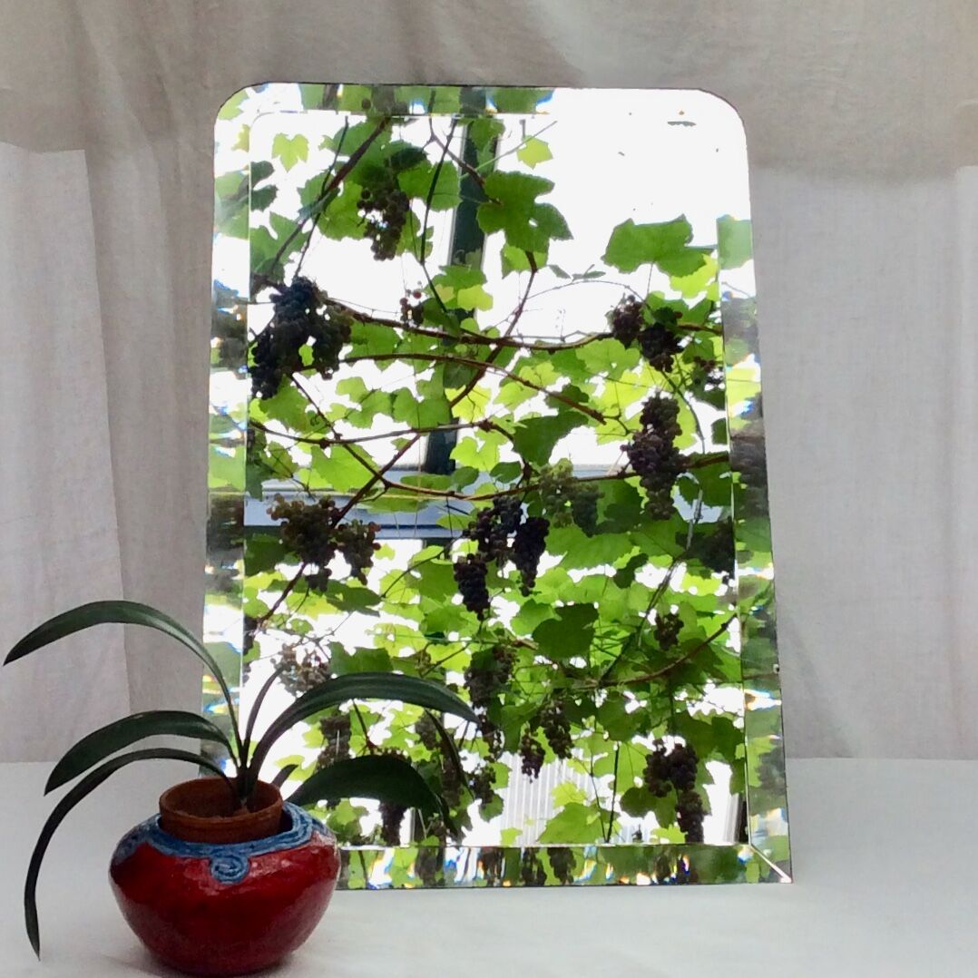 Old beveled mirror with lead or mercury stitched dimension: height -72.5cm- width -48.5cm-