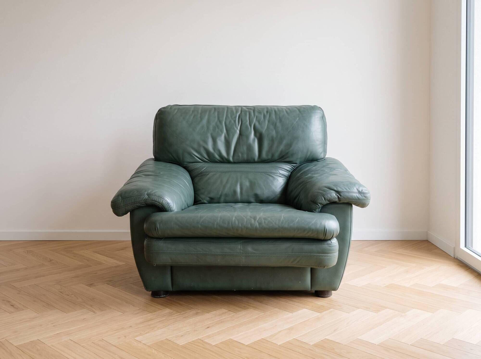 Vintage green leather armchair