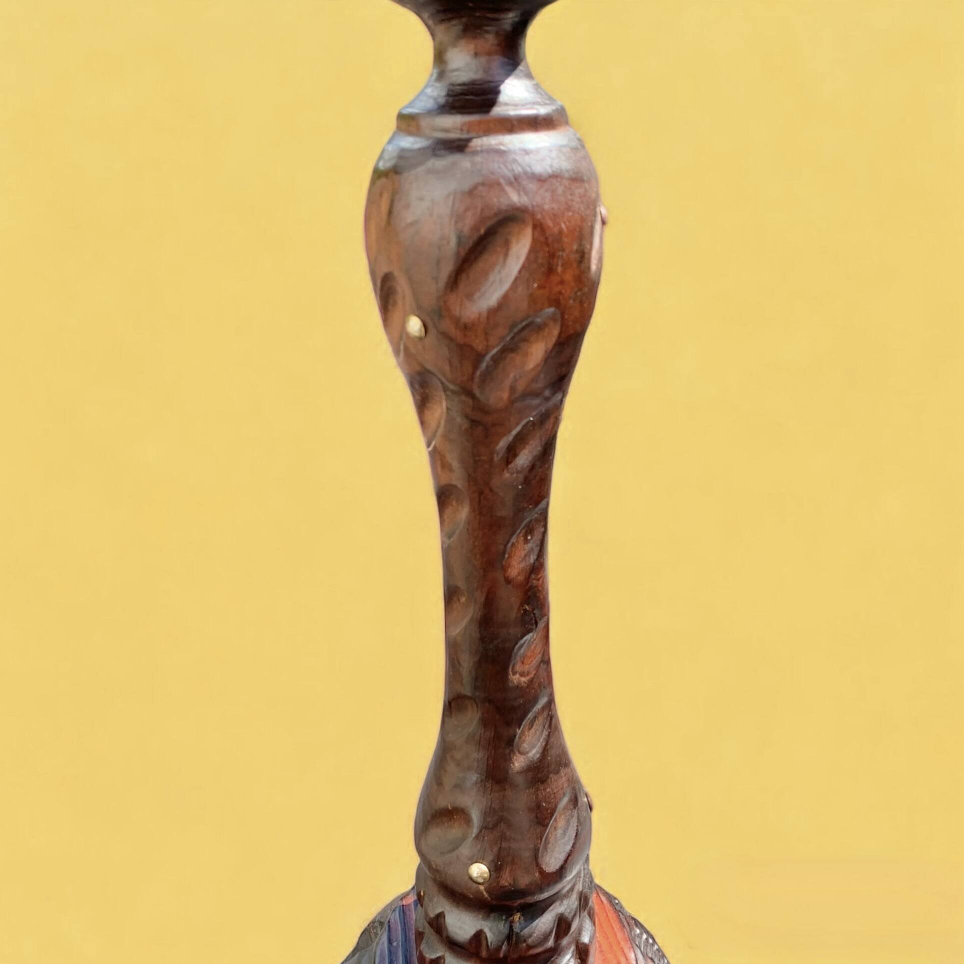 Old ashtray on carved wooden stand