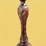 Old ashtray on carved wooden stand