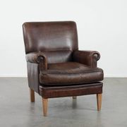 Characterful sheep leather armchair with a beautiful deep colour