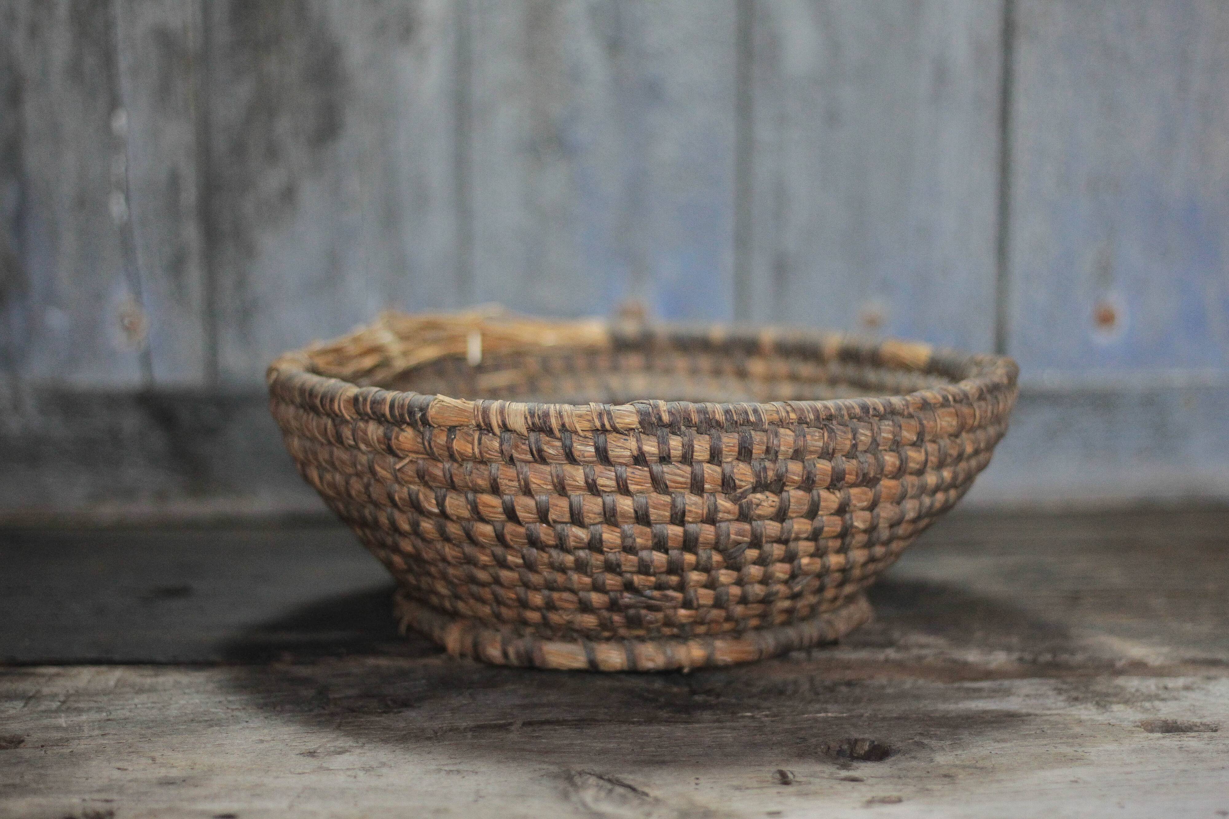 Old wicker basket, straw and bramble, woven basket, countryside.