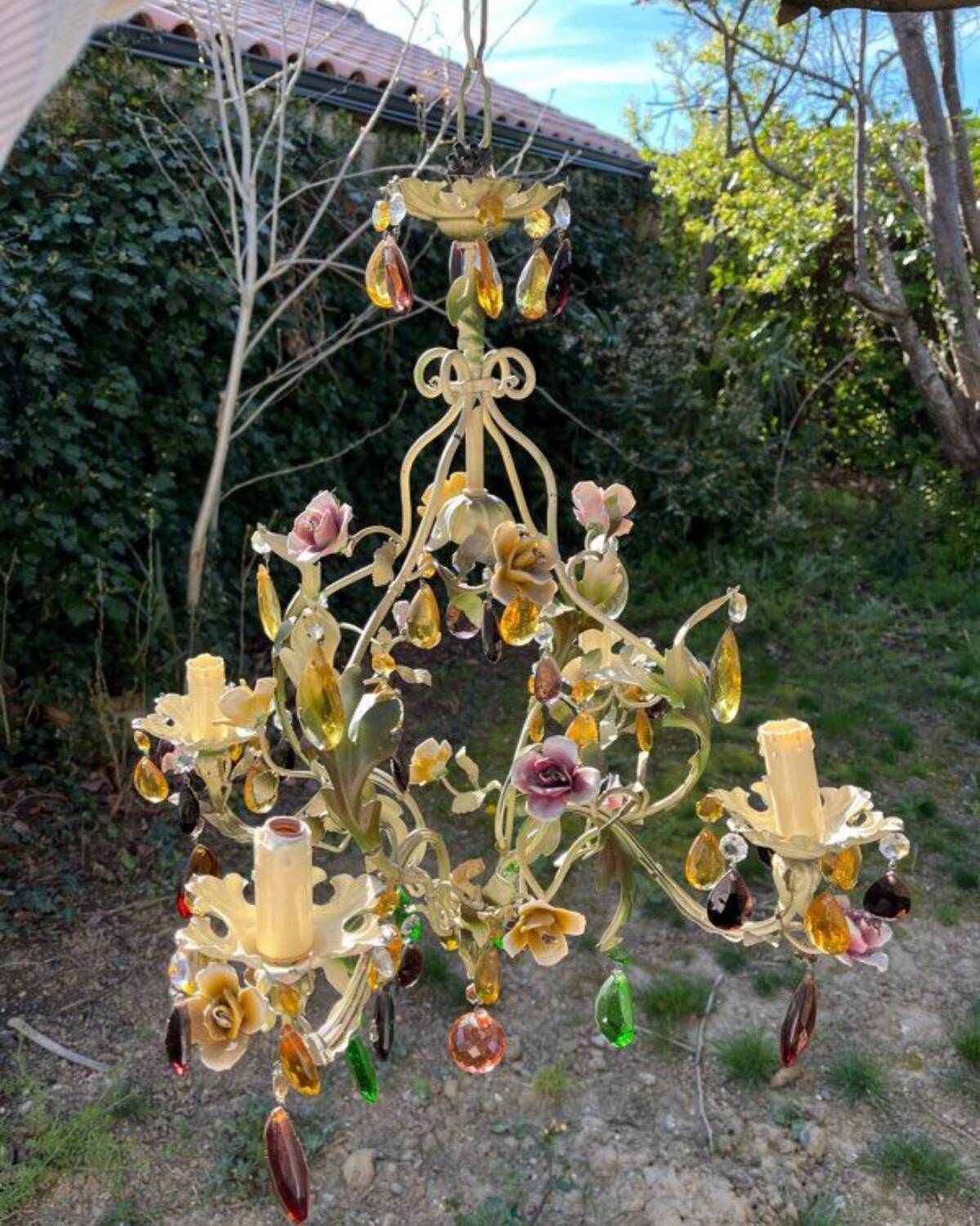 Vintage metal chandelier with porcelain flowers.