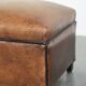 Characterful sheepskin footstool/ottoman finished with black piping